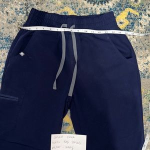 Small high waist fig scrubs small bleach mark to pocket